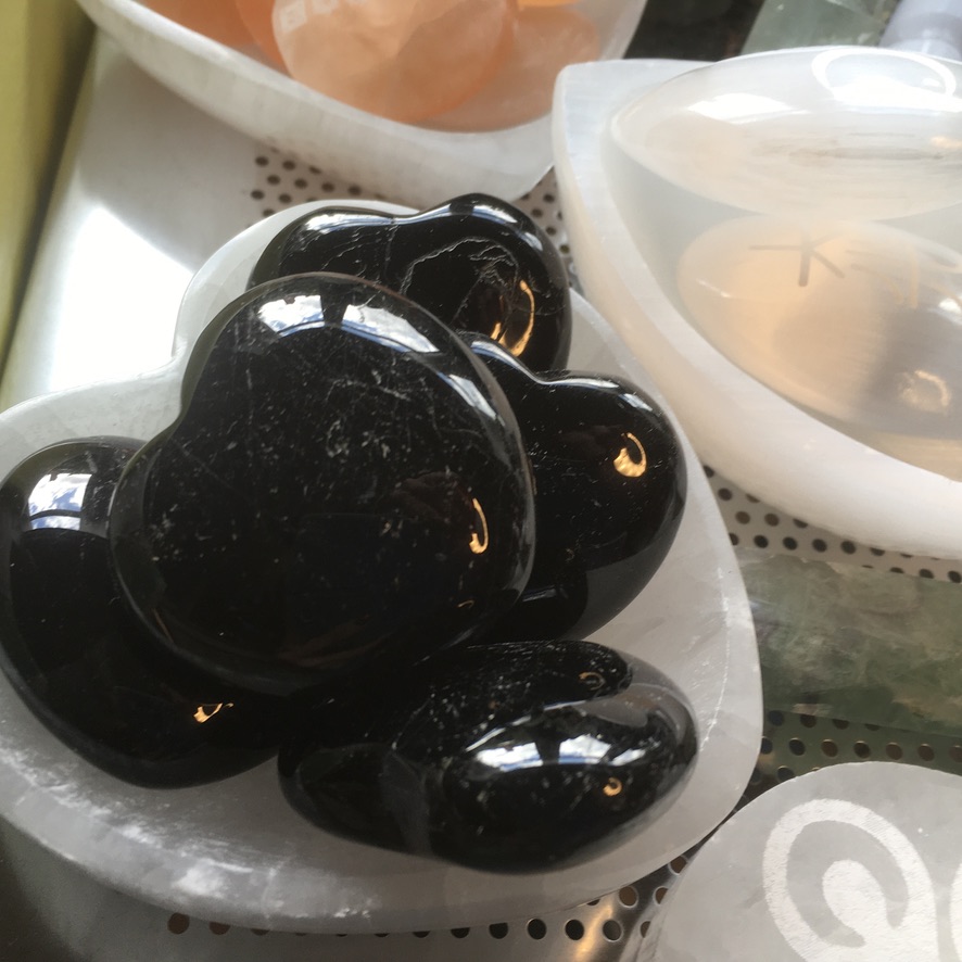 Black tourmaline polished puff hearts in Selenite Heart Trinket Bowl