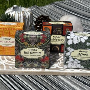 Goloka soya wax candles set in reusable tins with patterned gift boxes featuring Buddha, Nag Champa, Jasmine and Sandalwood fragrances with sacred ritual-inspired aromas.