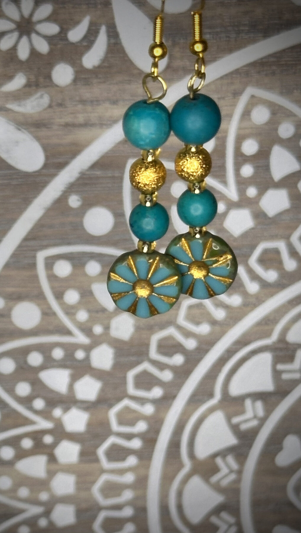 Turquoise bead and gold metal beads and flower bead earrings