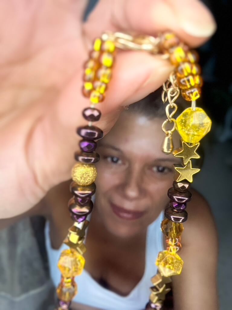 "Handmade Radiant Harmony Citrine and Hematite collar necklace shown up-close, held by Samantha of RockaBellaSoul."
