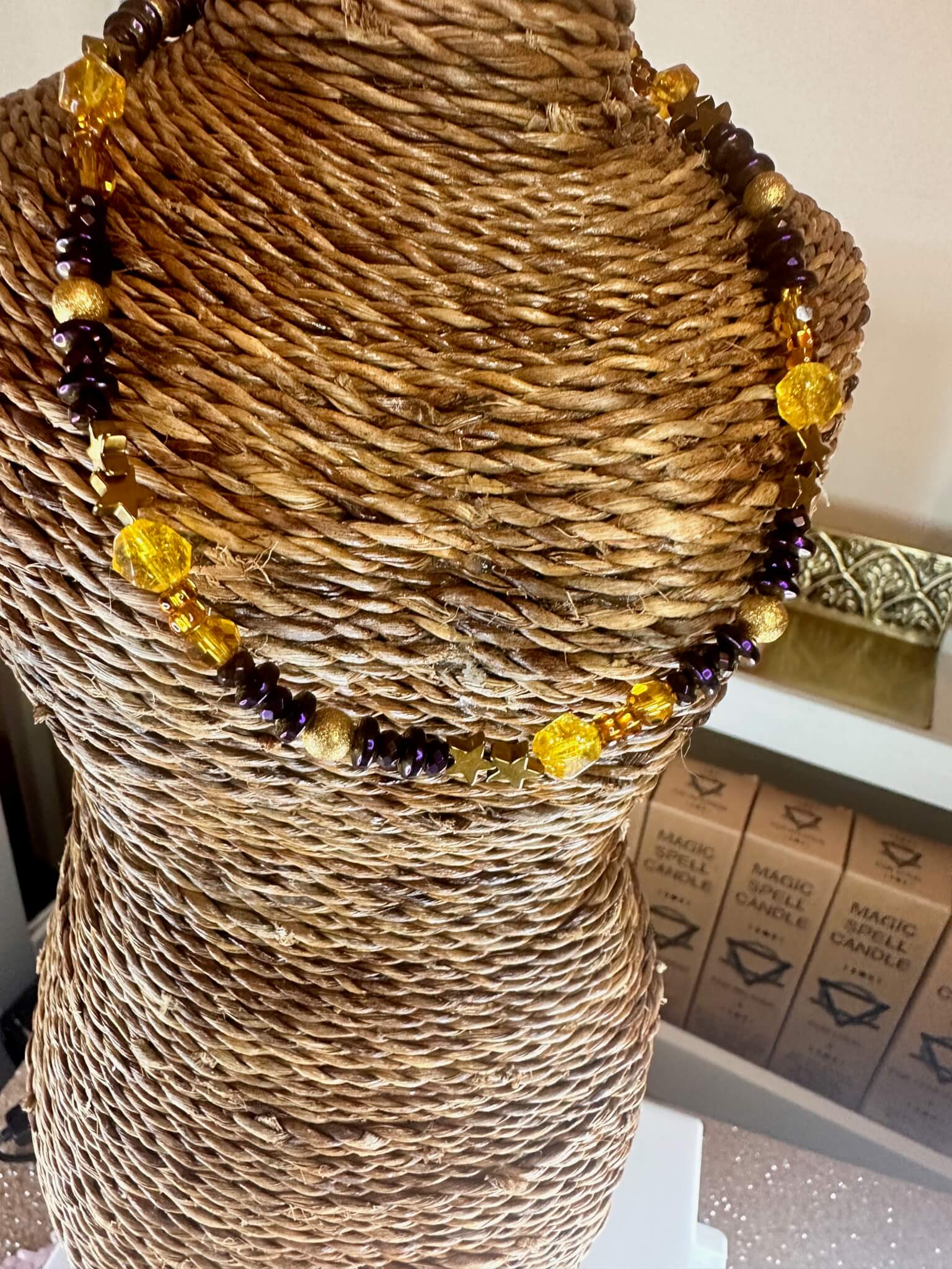 "Radiant Harmony Citrine and Hematite collar necklace displayed on woven mannequin bust."