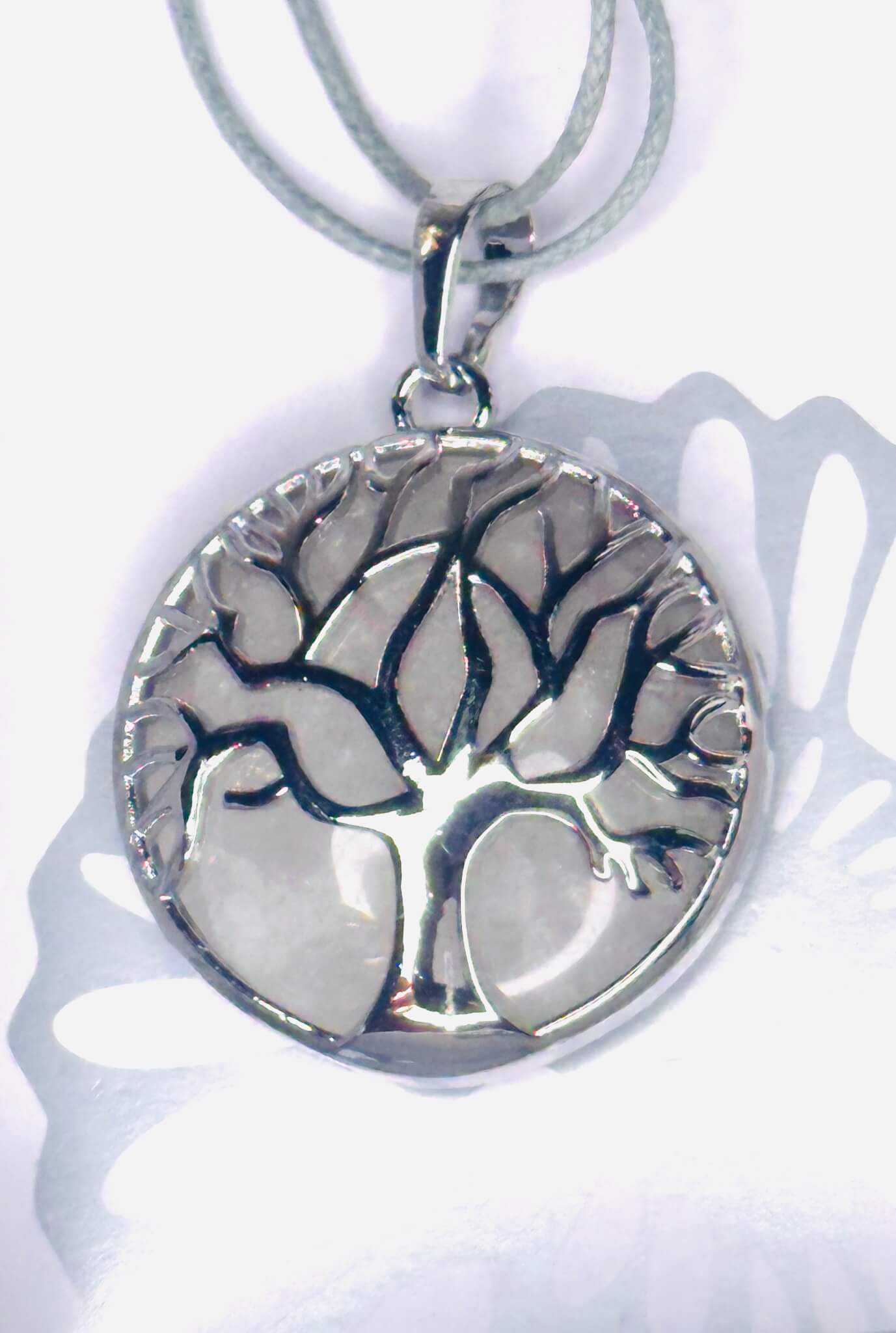 Clear Quartz Tree of Life chrome plated pendant on grey rope necklace