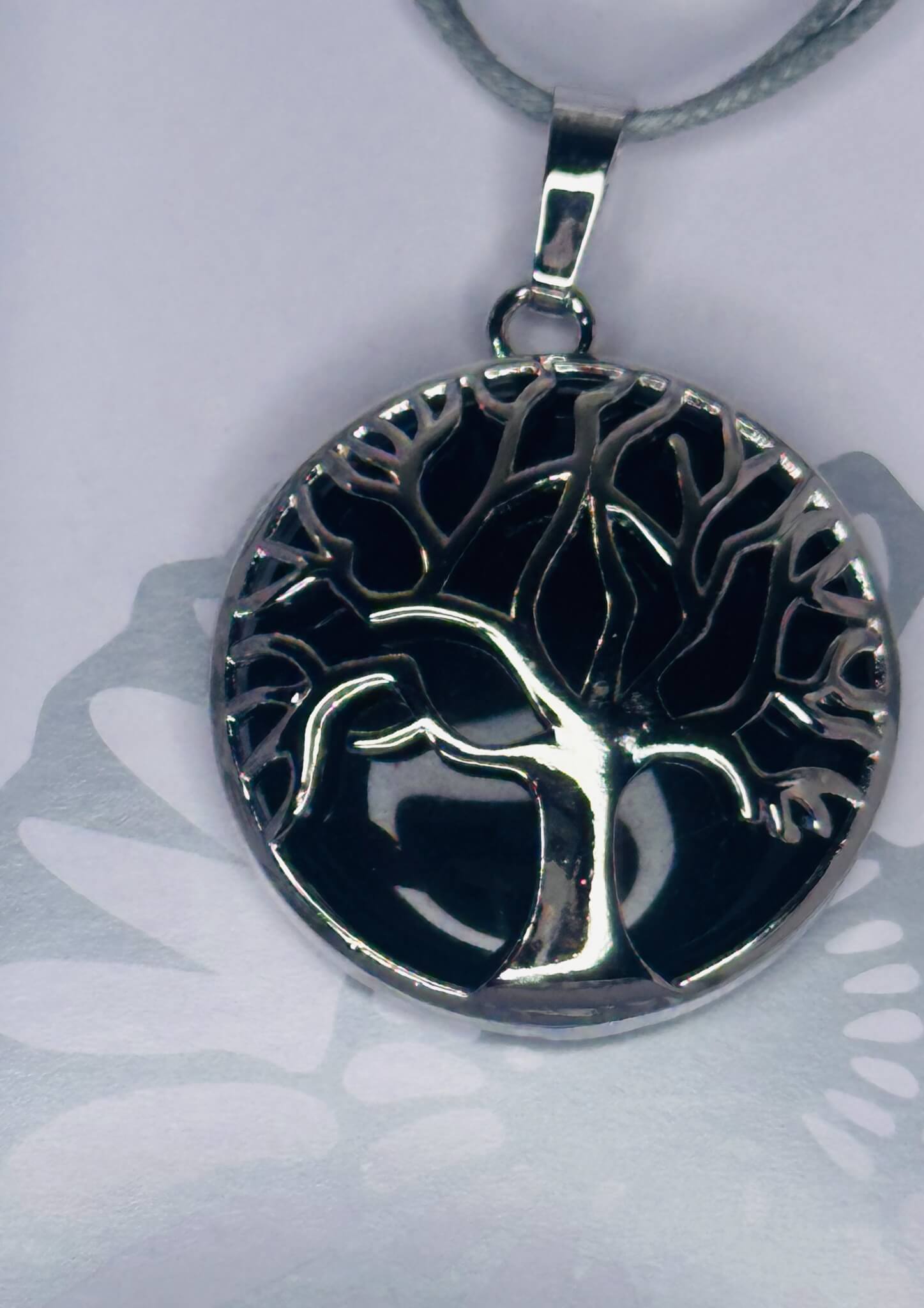 Black obsidian Tree of Life chrome plated pendant on grey rope necklace