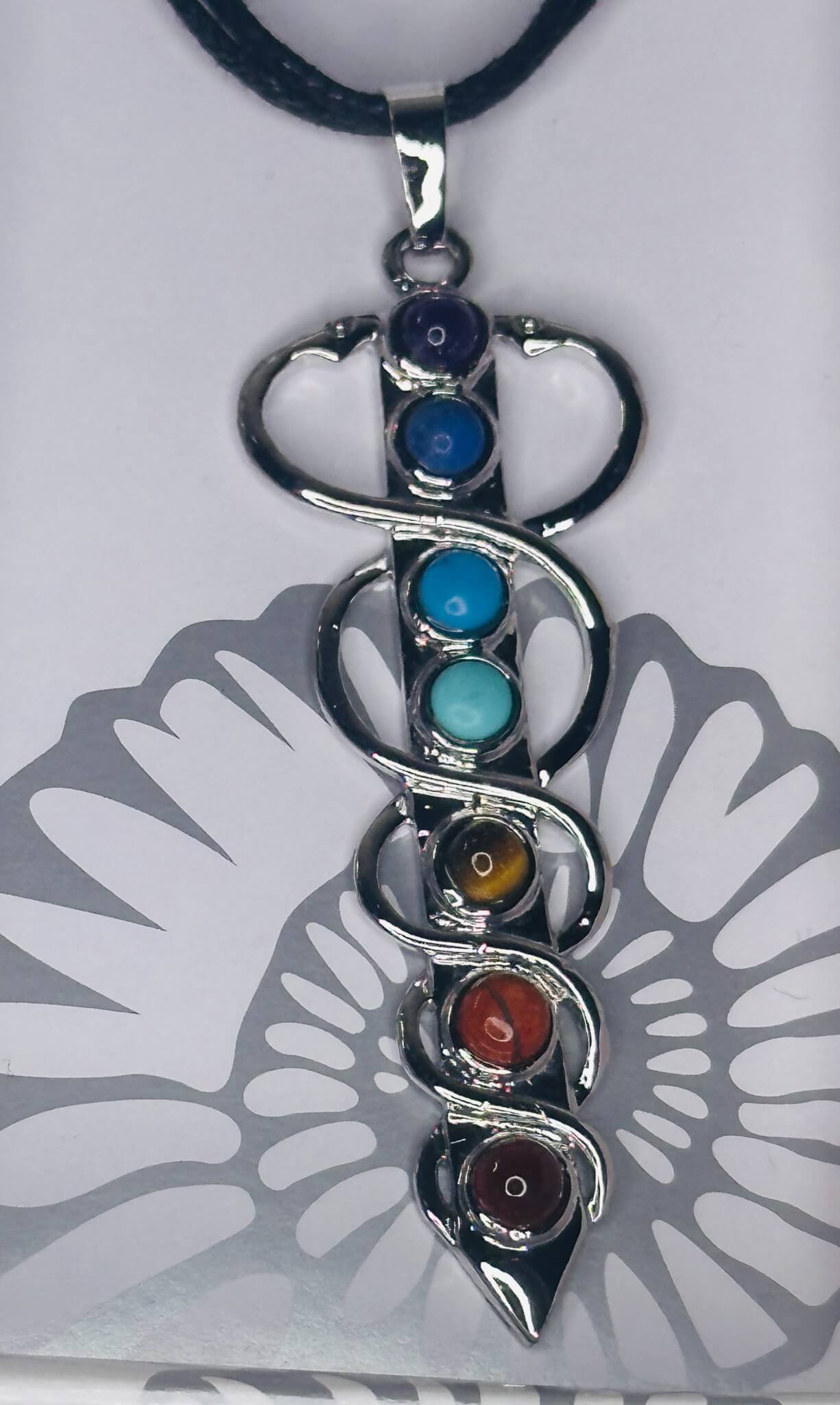 " 🐍 Caduceus (7 Chakra Stones)"“💎 Mixed chrome-plated chakra pendants with assorted gemstones”
