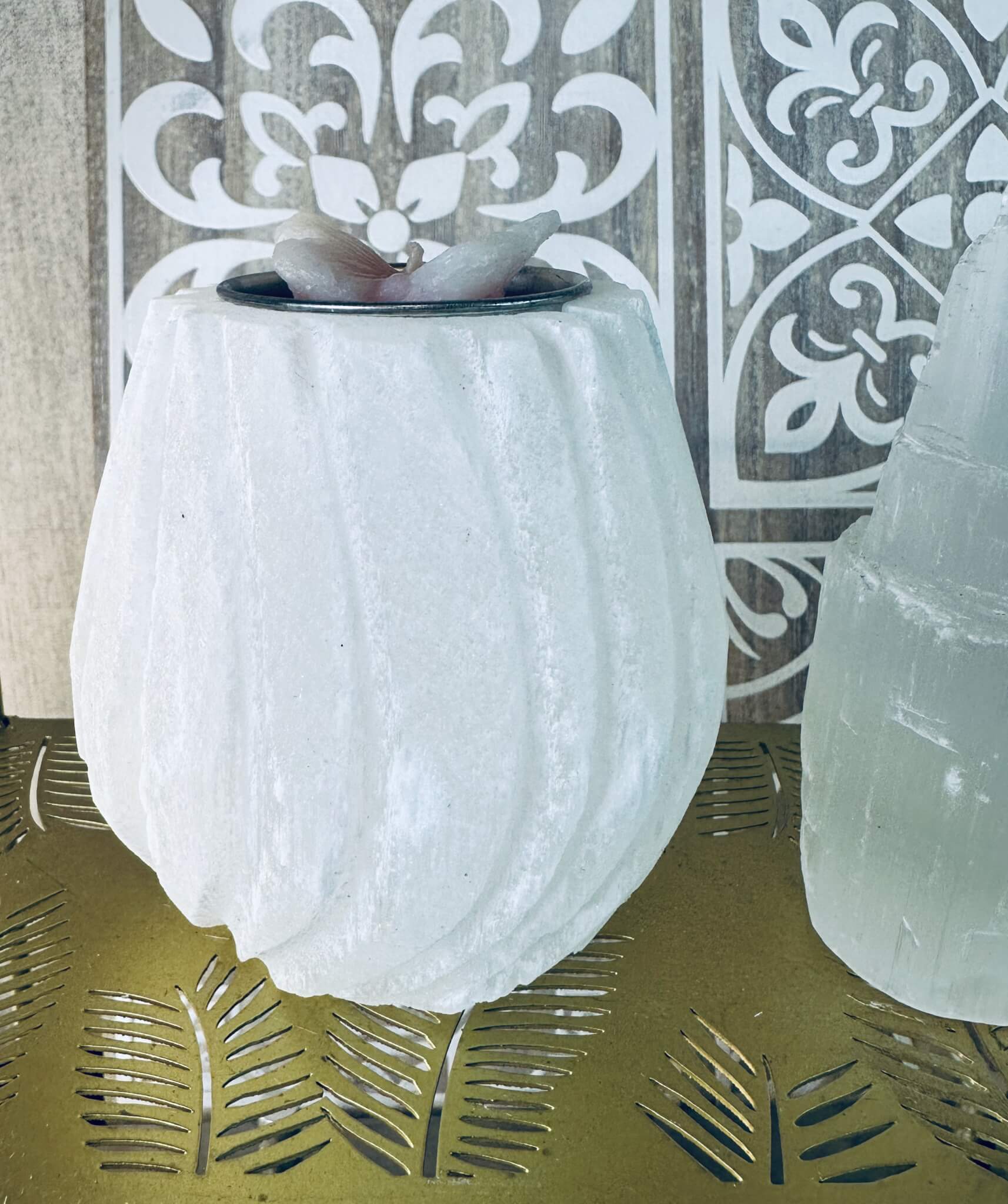 Selenite tealight candle holder glowing with soft spiritual light