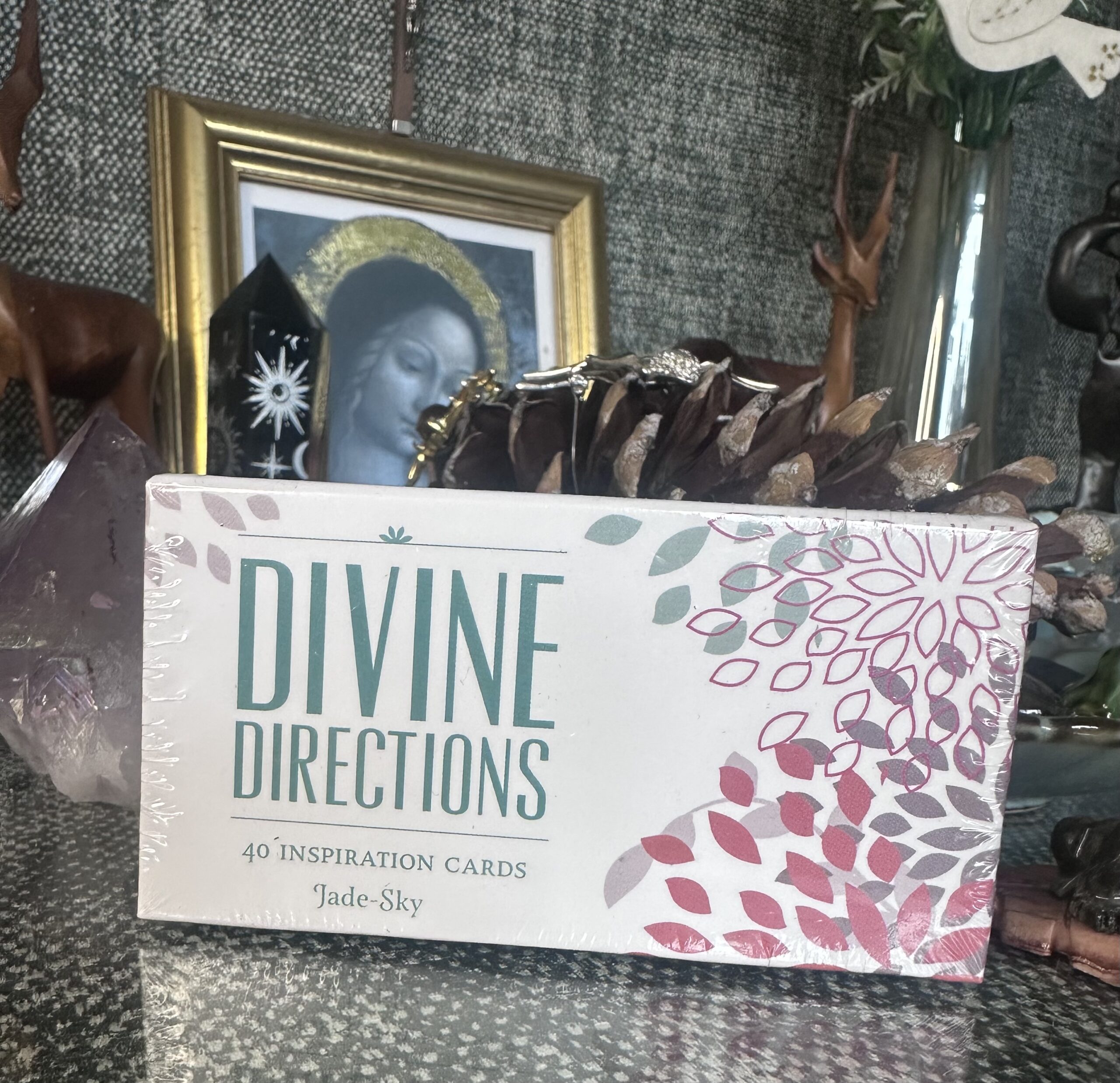 Pocket-sized Divine Directions oracle card deck with celestial-inspired artwork and 40 inspirational guidance cards for daily spiritual insight.
