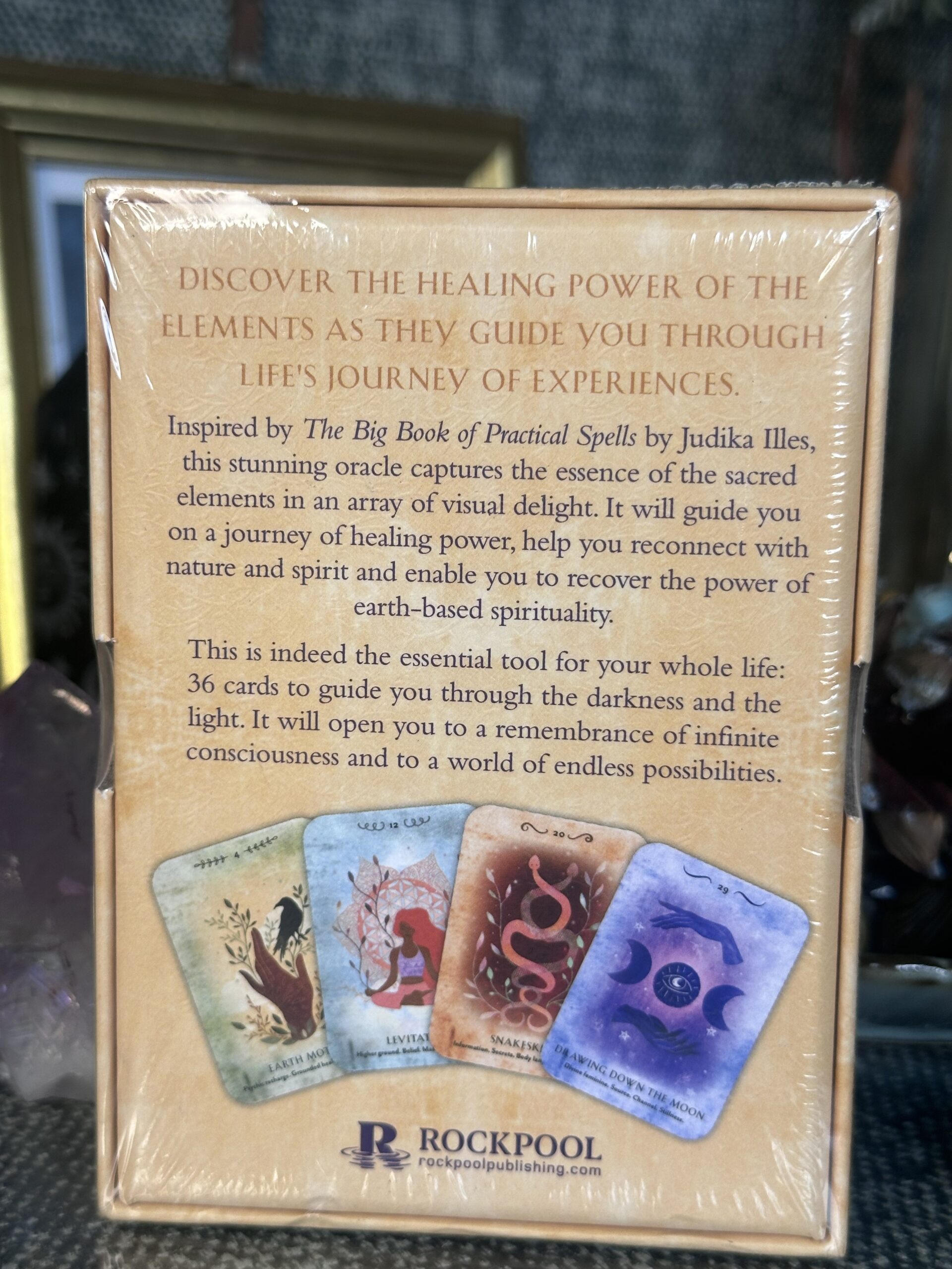 Pure Magic oracle cards and guidebook with elemental-inspired artwork exploring earth, air, fire and water healing energies for spiritual guidance and transformation.